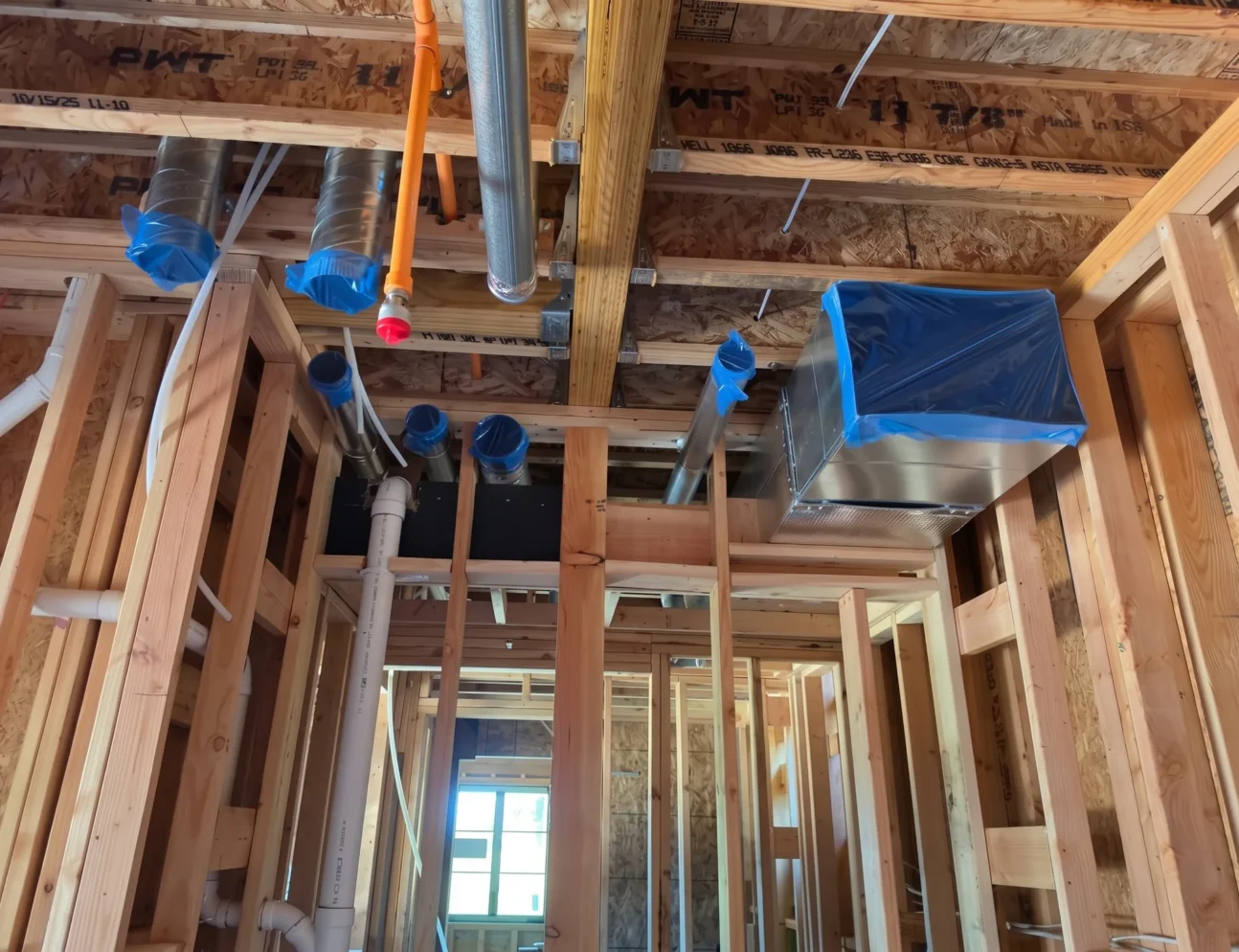 New construction HVAC ductwork installed in home framing by Elite Mechanical Systems